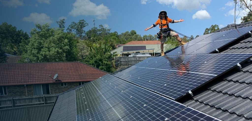 Auswell Energy technician installing solar panels